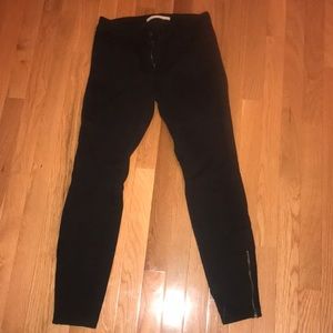 Black straight legged jeans with zip bottoms